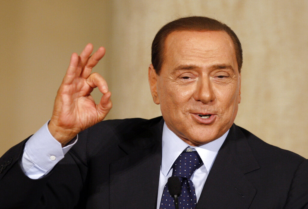 Italian Premier Silvio Berlusconi gestures during the launch of the book "Love always wins on envy and hatred" in Rome, Friday, March 19, 2010. Berlusconi launched Friday a book that collects the well-wishing notes that he received after an attack by a mentally ill man in December broke his nose and two teeth. (AP Photo/Alessandra Tarantino)